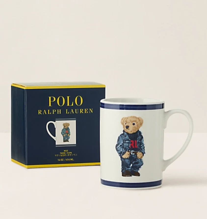 Polo Ralph Lauren mug with bear design and packaging on a light beige background